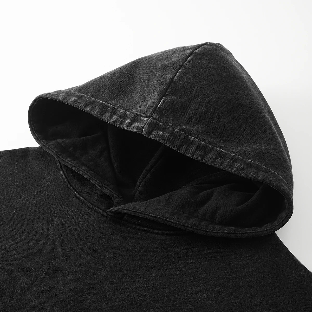 Close-up of the retro hoodie hood, showcasing the soft fabric and detailed stitching, emphasizing its vintage-inspired design and comfortable fit.